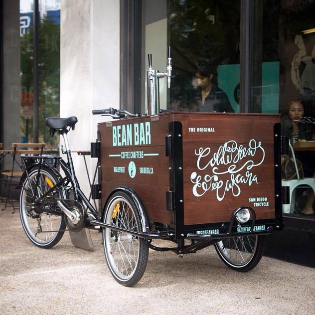 hand painted branded for Bean Bar custom cedar box Cold Brew Bike parked on the sidewalk