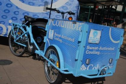 Icicle Tricycles Experiential Marketing Cargo Bike with a powder coat frame and custom branding parked at a festival