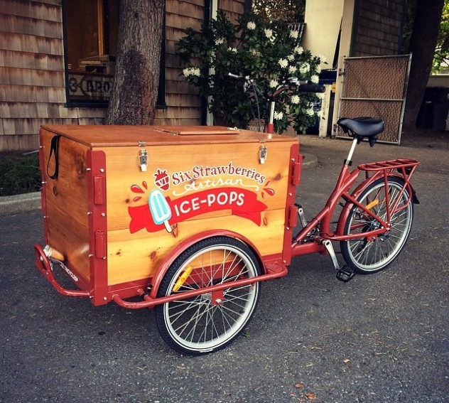 a cedar cargo box icicle tricycles Popsicle ice cream food bike / trike with a red frame branded for six strawberries bike