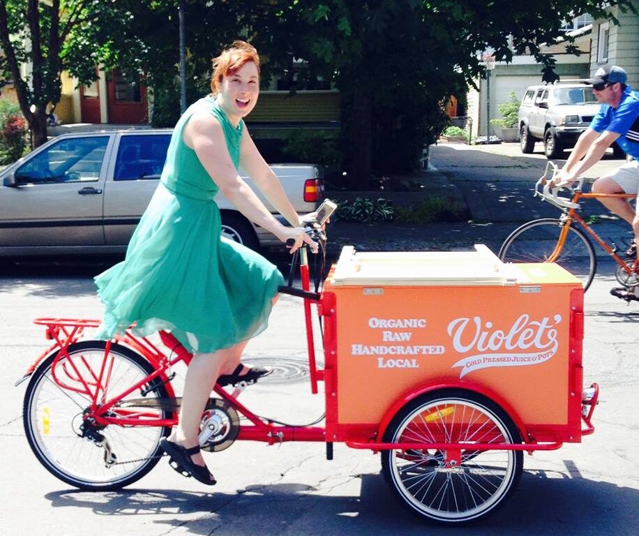 woman riding custom wrap red trike. Mobile vending bike. Ice Cream Bike. Icicle Tricycles