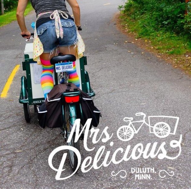 mrs delicious icicle tricycles branded ice cream bike / trike being ridden down a bike path