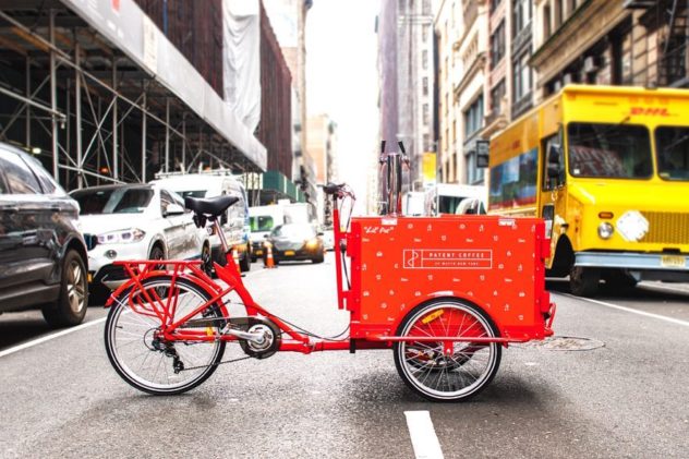 An all red cold brew coffee bike in the streets 